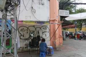 and turn the corner for a hair cut at the street-side barber.