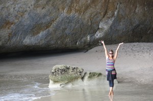 Noelle striking a pose under the arch of Cathedral Cove.
