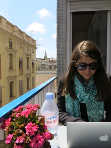 Noelle enjoying some sun on the balcony of our room during our first day.