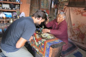 In the hill town of X, Dave and I received blessings at the local monastery. 