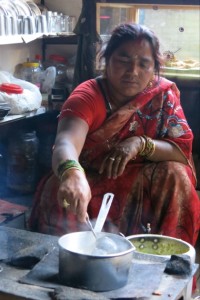 A Hindu woman in X invited us into her home as she prepared our tea.