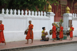 A few of the younger monks collecting alms.