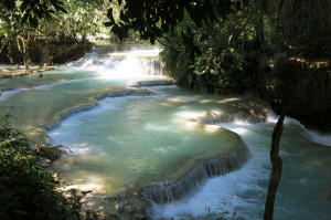 Emerald green waters at Kuang Si waterfalls.