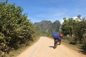 Locals biking between villages. 