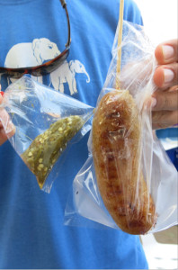 Rice sausage and green chili sauce, served fresh in plastic bags.