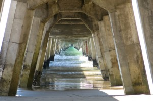 Water rushing through the wharf underbelly.