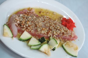 Tiradito is a Peruvian dish of raw fish, similar to sashimi and carpaccio, served in a spicy sauce.