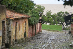  Colonia's "Street of Sighs," an 18th-century mossy-stoned passageway, lined with ochre and russet stucco buildings.